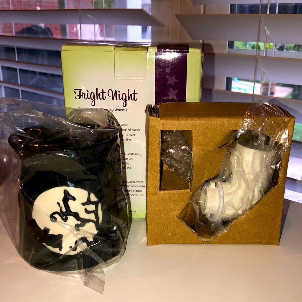 Brand new, in box, Fright Night warmer. Plug-in, (directly into outlet).